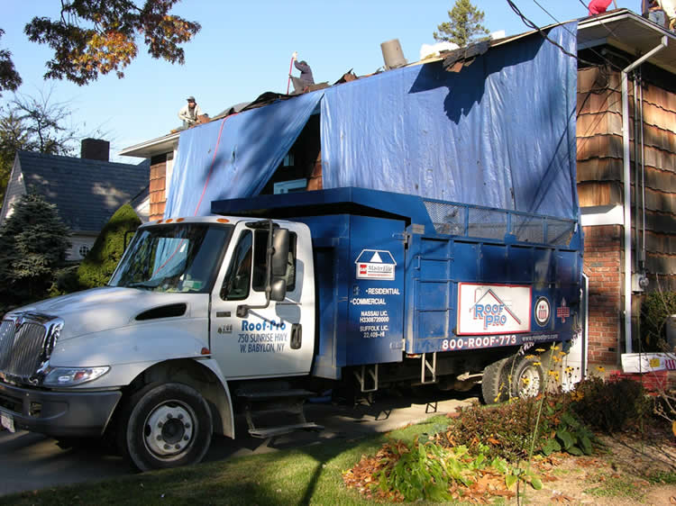 old roof put in dump truck